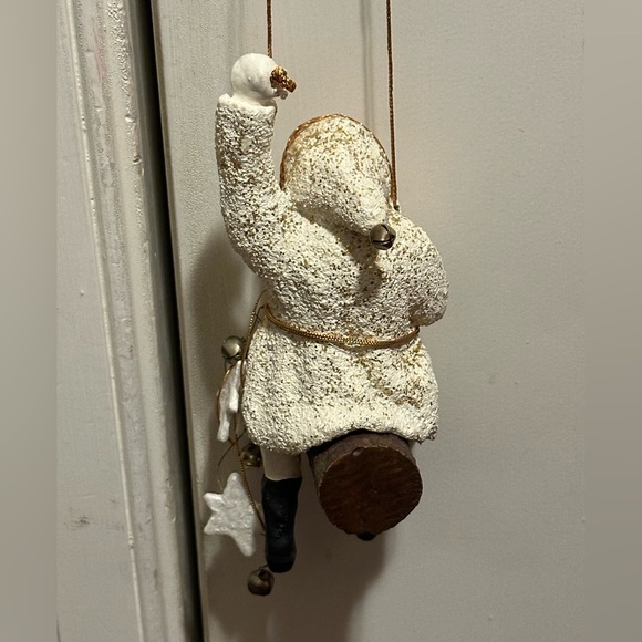 Wild western Santa hangs from gold thread with stars and bells. - Picture 3 of 8